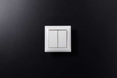 close up of light switch on black backgroundの写真素材