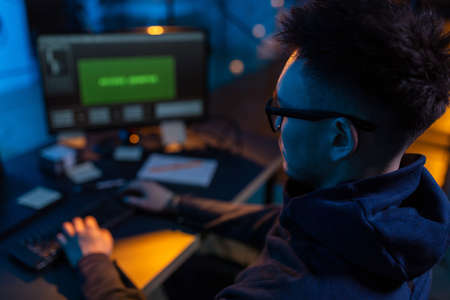 hacker using computer virus for cyber attackの写真素材