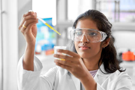 scientist with chemical working in laboratoryの写真素材
