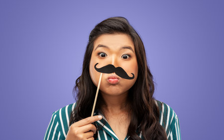 woman with vintage moustaches party propの写真素材