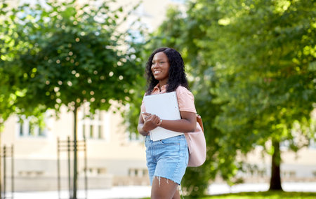 african student girl with notebooks in cityの写真素材