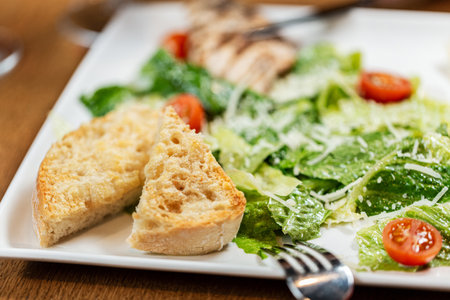 close up of toasted bread and vegetables on plateの写真素材