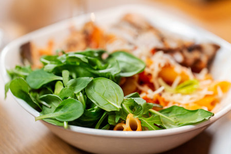 close up of pasta with vegetables on plateの写真素材