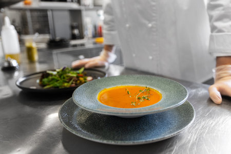 close up of chef with food at restaurant kitchenの写真素材