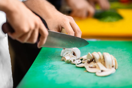 close up of chef cooking food on kitchenの写真素材