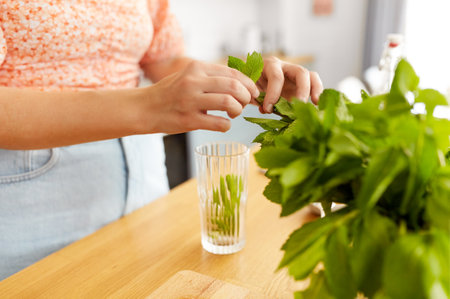 woman making cocktail drinks at home kitchenの写真素材
