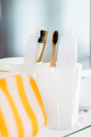 cosmetic bag and toothbrush on mirror in bathroomの写真素材