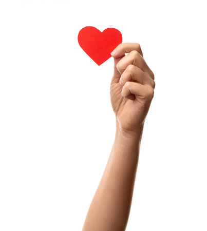 close up of hand holding red paper heartの写真素材