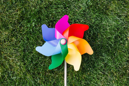 close up of pinwheel on green lawn or grassの写真素材