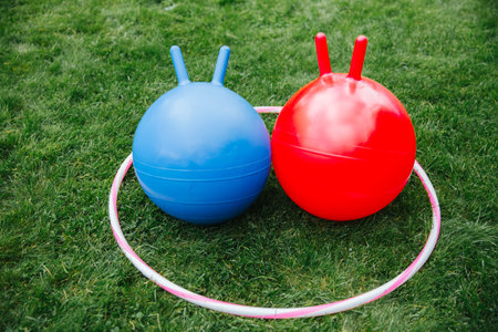 bouncing balls or hoppers and hoop on grass