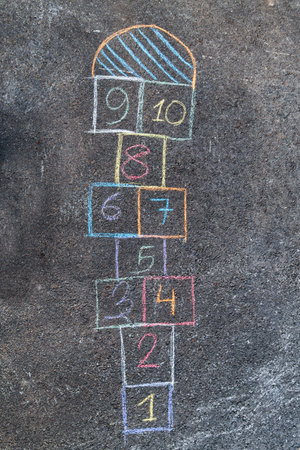 hopscotch chalk drawing on asphalt pavementの写真素材