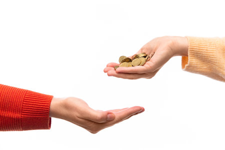 someone donating coins to another personの写真素材
