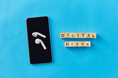 smartphone, earphones and digital detox wordsの写真素材