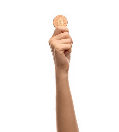 close up of hand with bitcoin over whiteの写真素材
