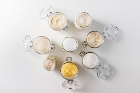close up of jars with different flours on tableの写真素材