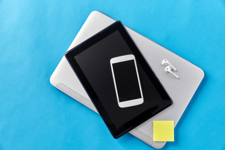 smartphone, tablet pc, laptop and earphonesの写真素材