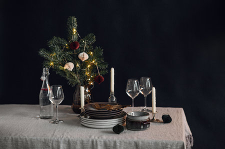 crockery and candles for christmas table servingの写真素材