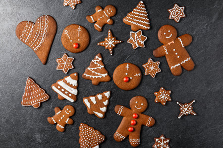 close up of iced gingerbread on black table topの写真素材