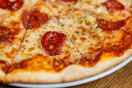 close up of sliced pizza margherita on plateの写真素材