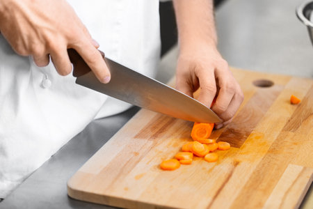 close up of chef cooking food on kitchenの写真素材