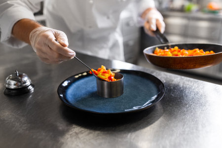 close up of chef cooking food at restaurantの写真素材