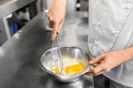close up of chef making batter on kitchenの写真素材