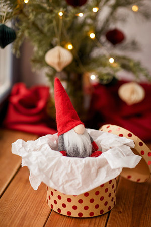 christmas gnome in gift box on window sill at homeの写真素材
