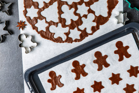 close up of raw gingerbread cookies on baking tray