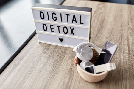 gadgets and digital detox words on light boxの写真素材