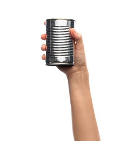 hand holding tin can with preserved foodの写真素材