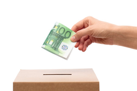hand putting euro cash money into donation boxの写真素材