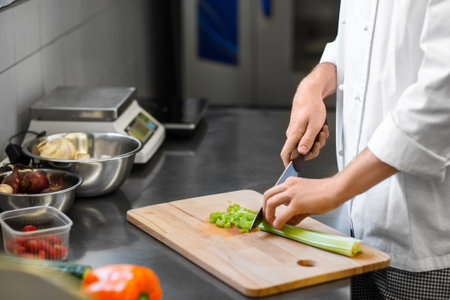 close up of chef cooking food on kitchenの写真素材