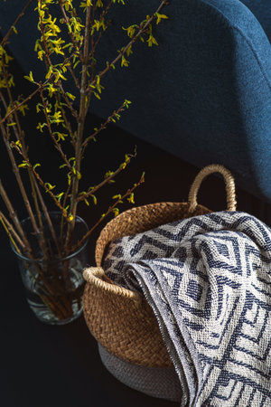 blue chair and blanket in basket over black wallの写真素材