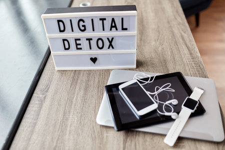 gadgets and digital detox words on light boxの写真素材