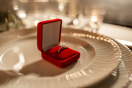 engagement ring in red box on served tableの写真素材
