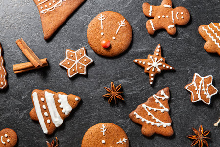 close up of iced gingerbread on black table topの写真素材