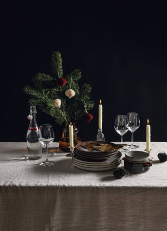 crockery and candles for christmas table servingの写真素材