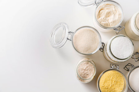 close up of jars with different flours on tableの写真素材