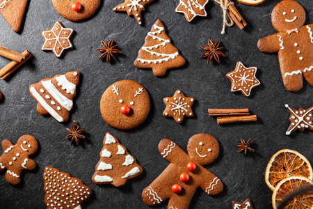close up of iced gingerbread on black table topの写真素材