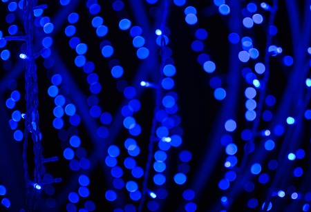 Blue defocused glitter background with  bokeh copy space. Blurs.の写真素材