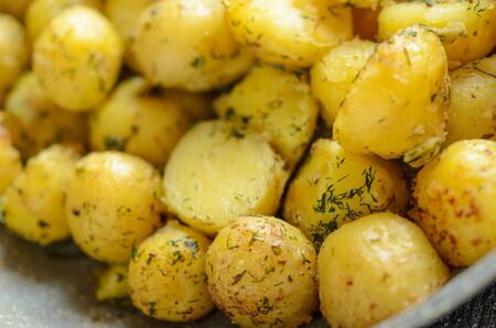 Close up roasted baby potatoes with herbs.の写真素材
