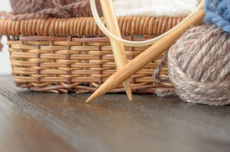 Crochet and knitting set. Yarn balls and wood needles. Homemade hobby concept