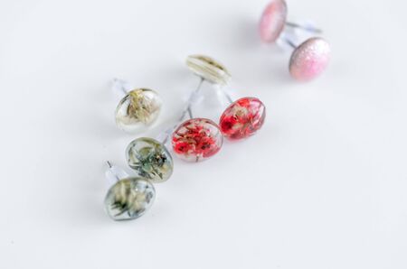 Creative handmade stud earrings. Jewelry backgroundの写真素材