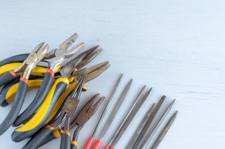 Metal jewelry making tools on the table. Creative craft concept