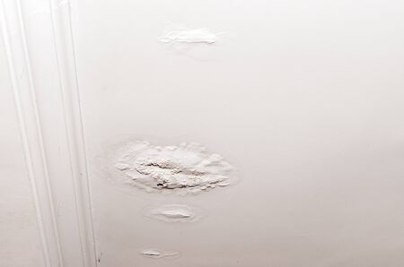Stains on the ceiling a result of leaking rain water roof. House insurance