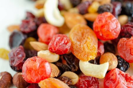 Mix of dried fruits and nuts close up background.の写真素材