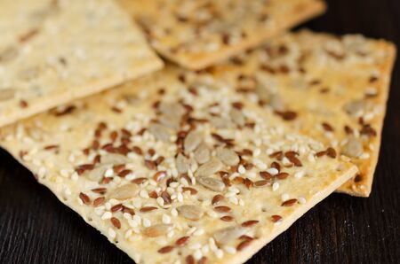 Crunchy multigrain cookies on a dark background. Healthy food concept.