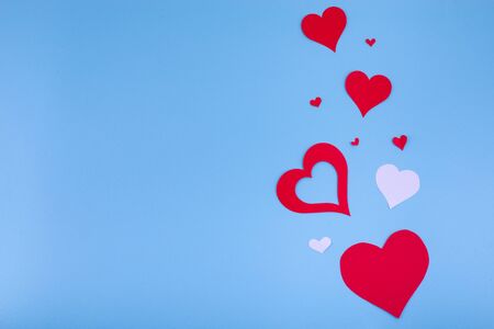 Valentines day abstract background with paper cut red hearts decoration, flat layout, empty space for textの写真素材