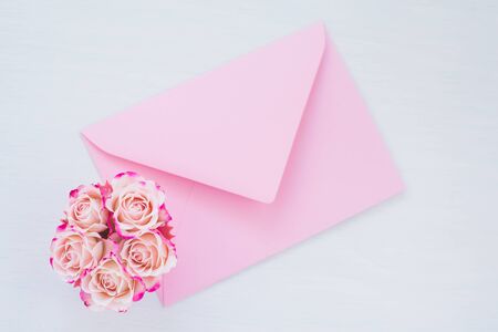 Framework of pink roses and gifts. Spring concept, flat lay, copy space