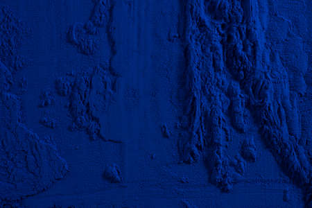 Blue spirulina powder texture on white background. Phycocyanin extract. Natural superfood, vegan,...